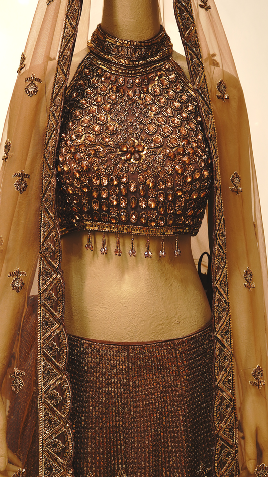rust brown lehenga with rich antique gold and bronze embellishments