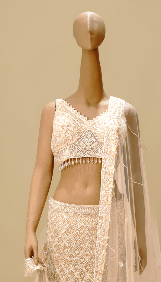 White exquisite masterpiece crafted lehenga with intricate detailing