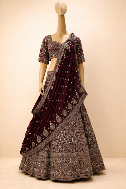 Burgundy bridal lehenga with intricate embroidery