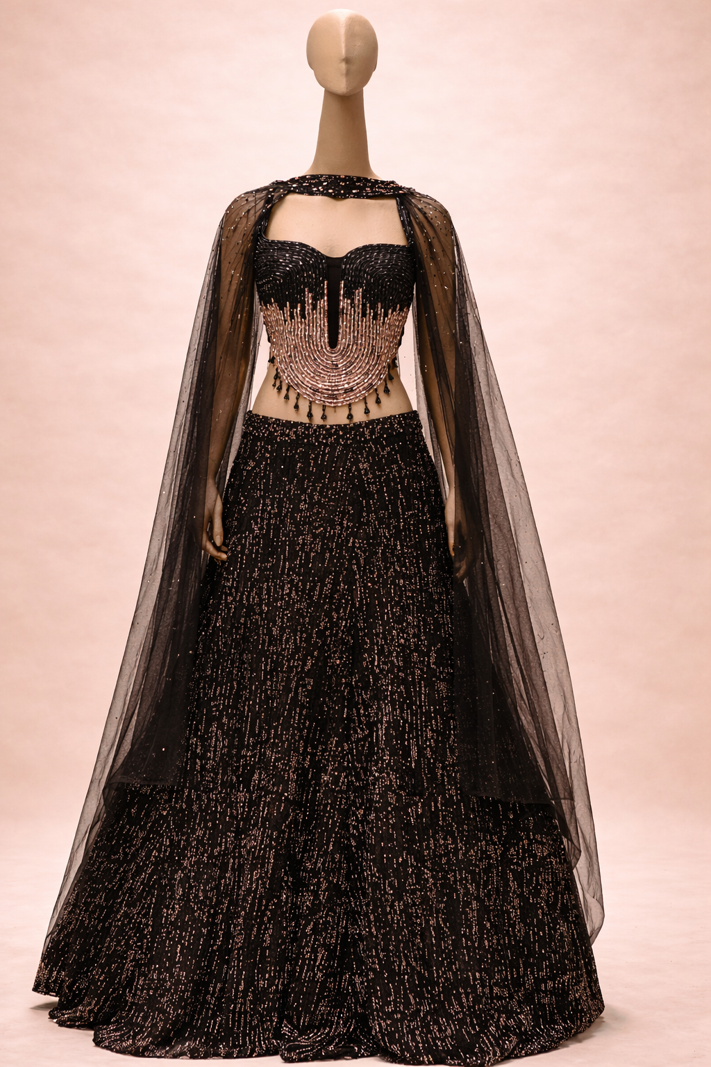 A striking black lehenga with Metallic Gold embellishments