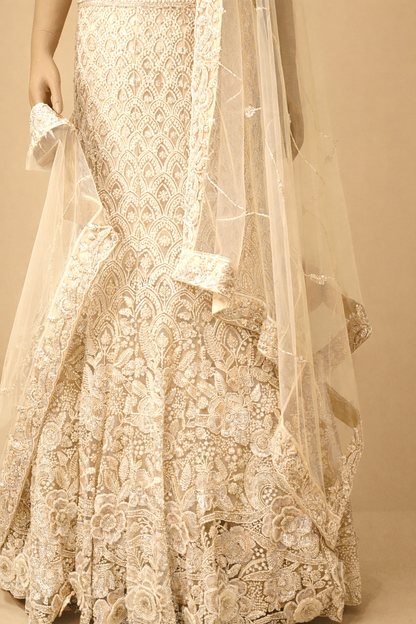 White exquisite masterpiece crafted lehenga with intricate detailing