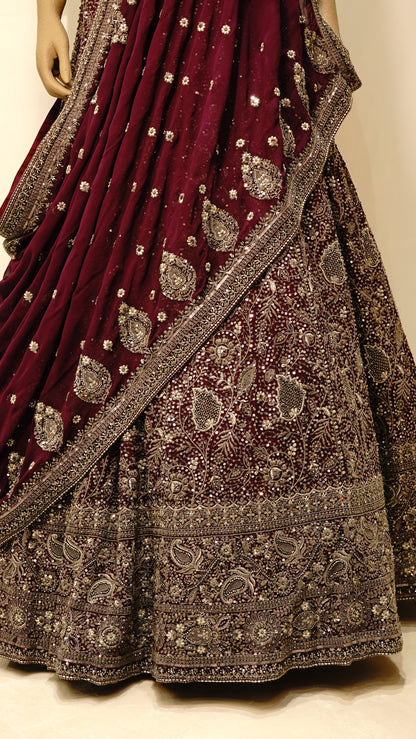 Burgundy bridal lehenga with intricate embroidery