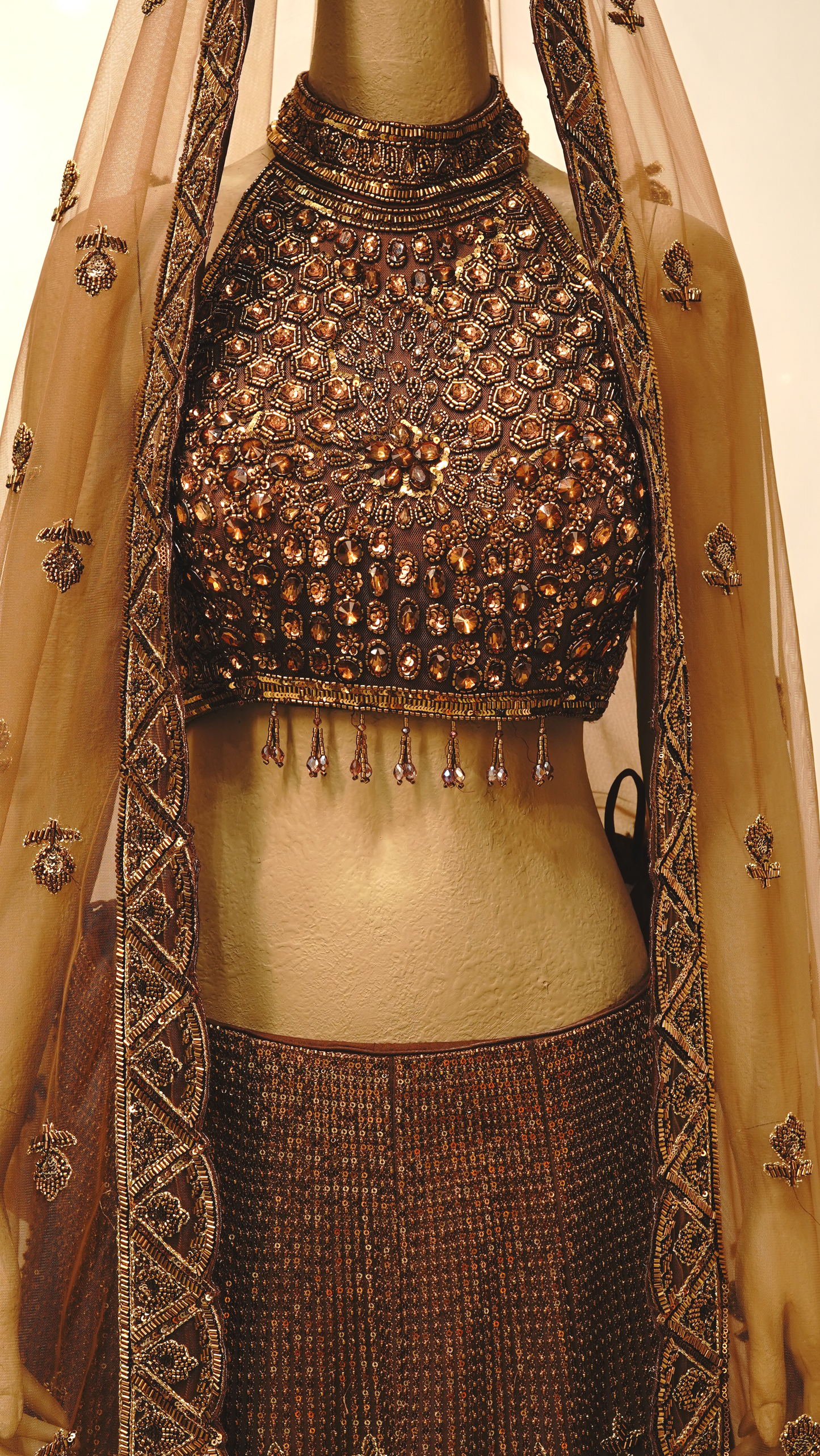 rust brown lehenga  with rich antique gold and bronze embellishments