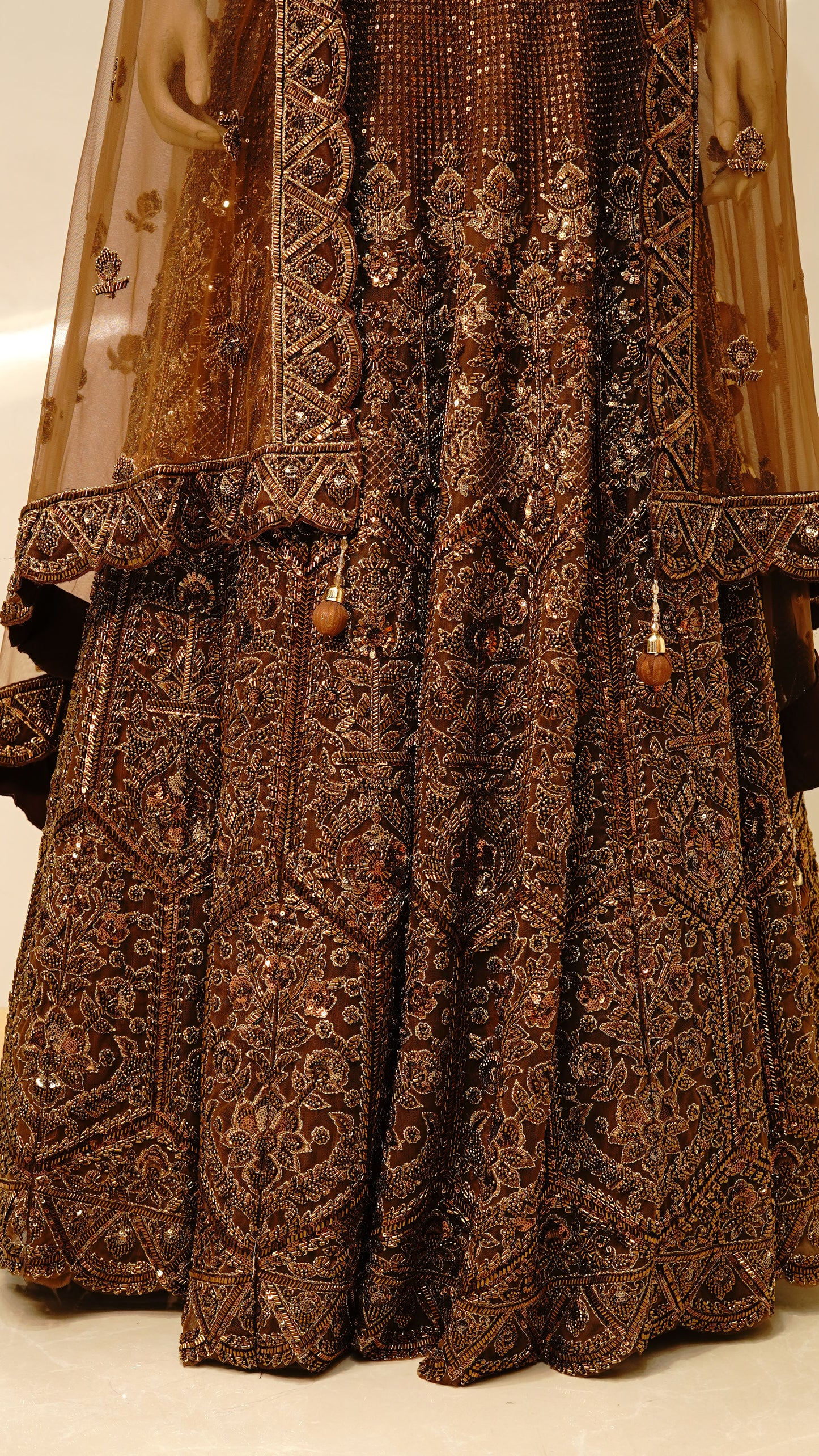 rust brown lehenga  with rich antique gold and bronze embellishments