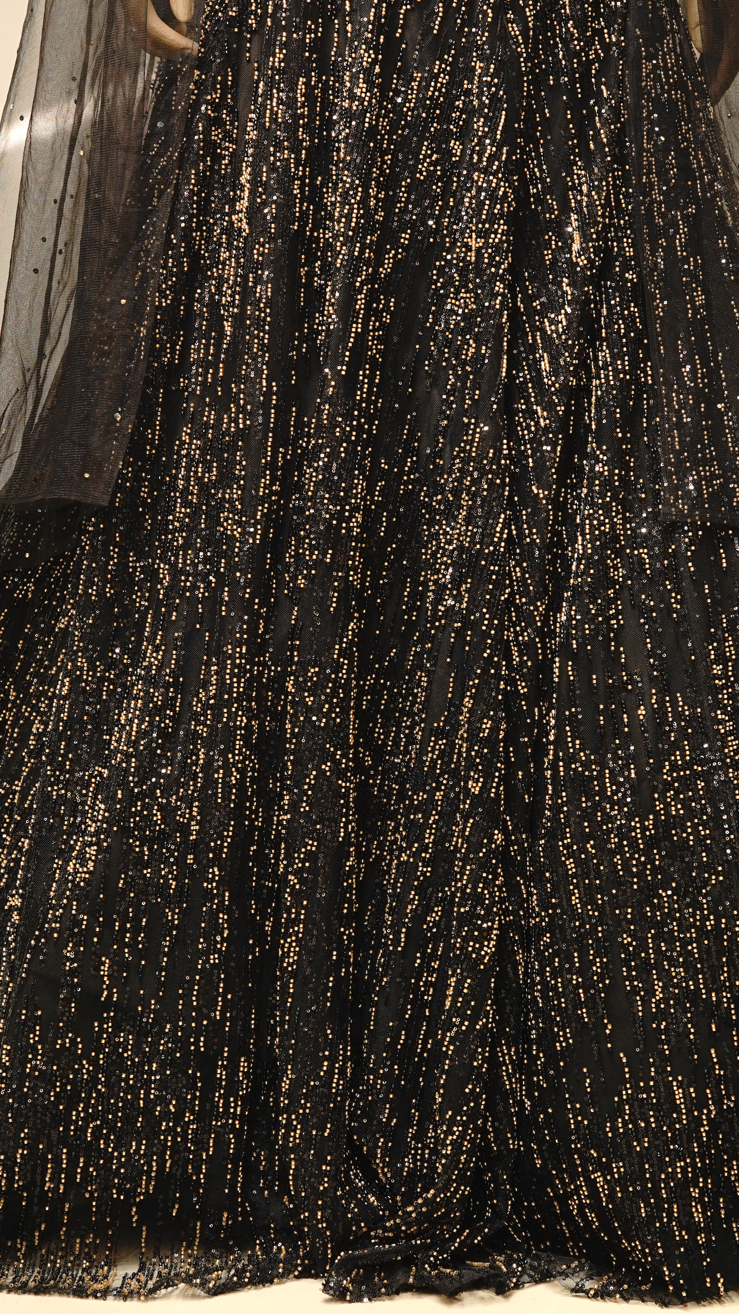 A striking black lehenga with Metallic Gold embellishments
