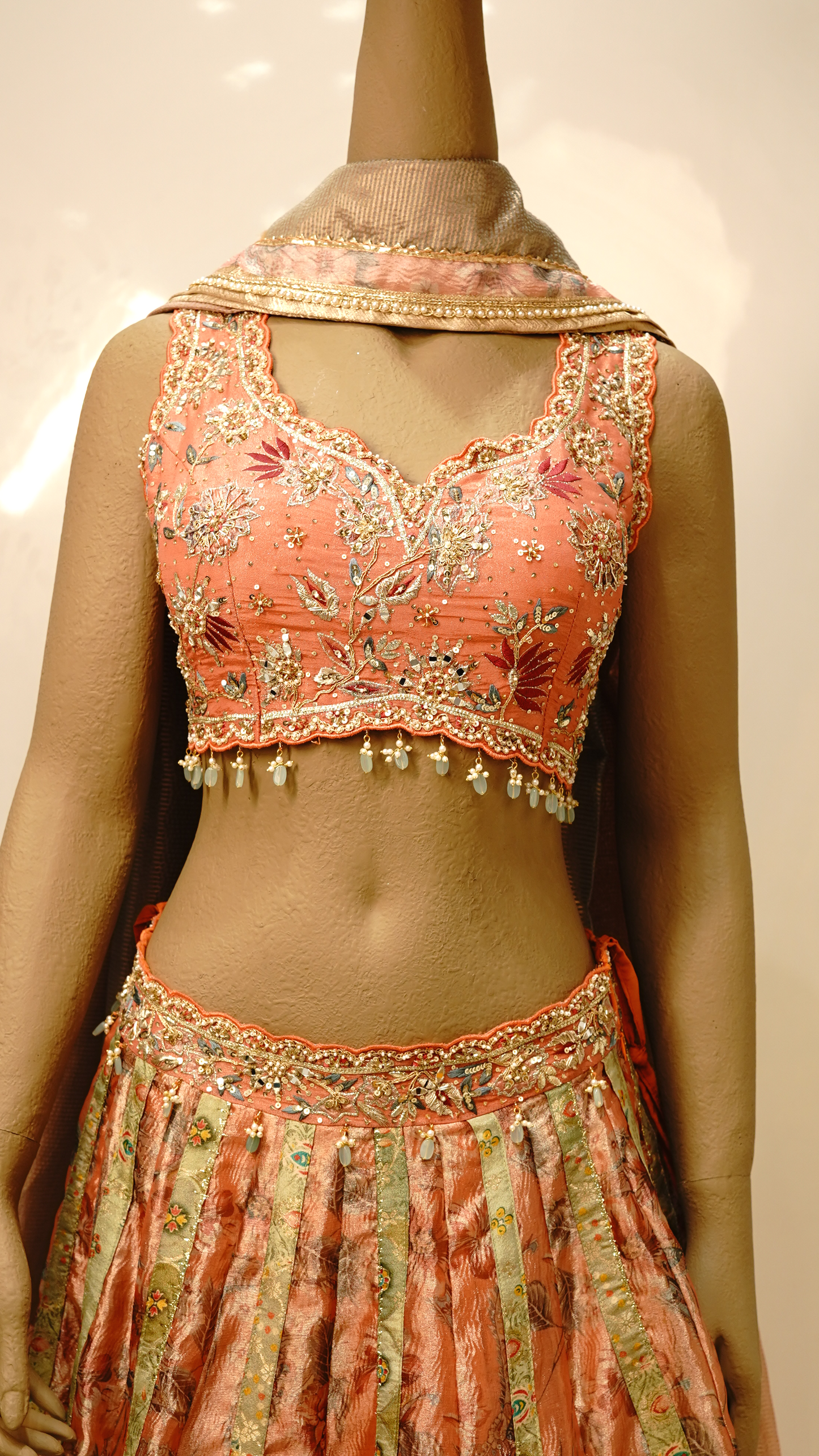 Peach lehenga with Soft Gold & Pastel Accents