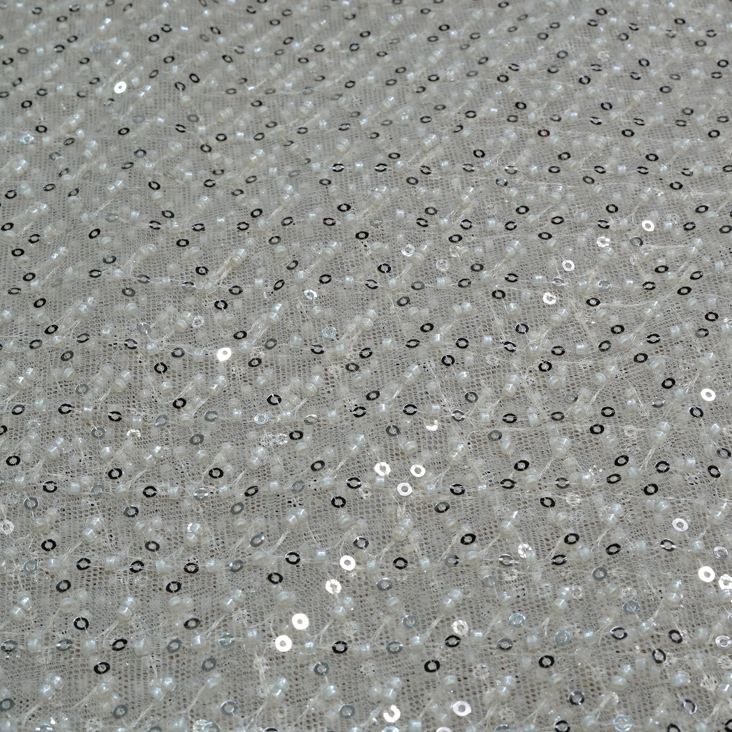 Elegant Ivory Shimmer Embellished Net Fabric