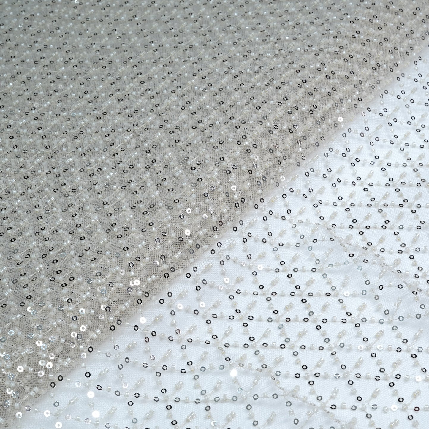 Elegant Ivory Shimmer Embellished Net Fabric