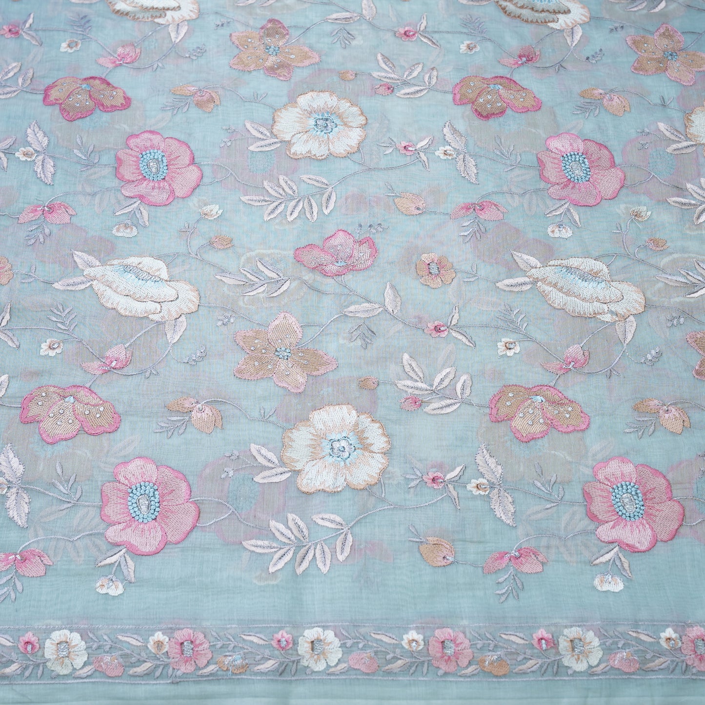 Powder Blue Floral Embroidered Fabric .